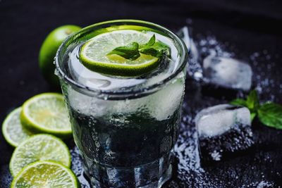 Close-up of lime in glass of water