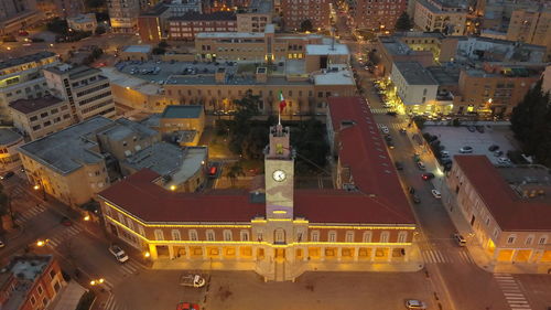 High angle view of illuminated buildings in city