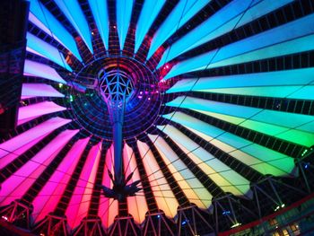 Low angle view of colorful ferris wheel