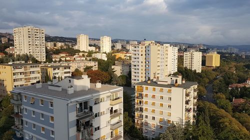 High angle view of buildings in city against sky