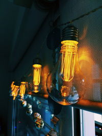 Close-up of illuminated light bulb