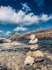 Stack of rocks against sky