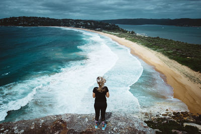 Full length of man standing on beach