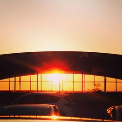 Car on road at sunset