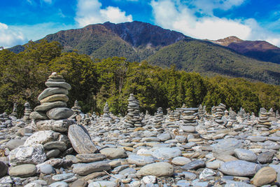 Stone wall and rocks in mountains against sky