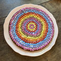 Directly above shot of multi colored candies in bowl on table