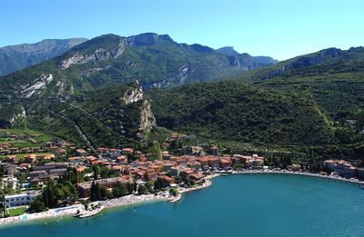 Scenic view of  lake garda and mountains against sky