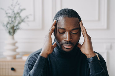 Portrait of mature man with eyes closed