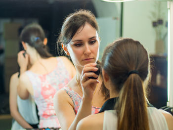 Beautician dressing customer at spa