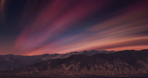 Scenic view of mountains against sky during sunset