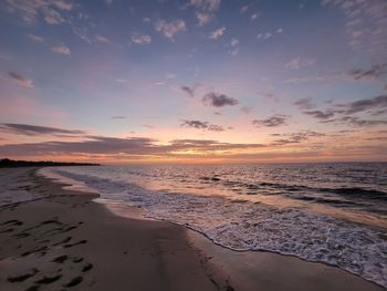Scenic view of sea against sky during sunrise