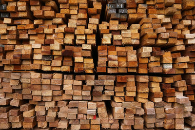 Full frame shot of wooden logs in forest