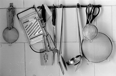 Various utensils hanging in kitchen