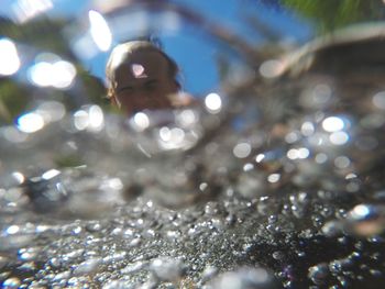 Blurred motion of woman in water