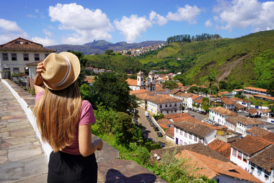 Rear view of woman looking at townscape