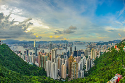 Panoramic view of buildings in city against sky