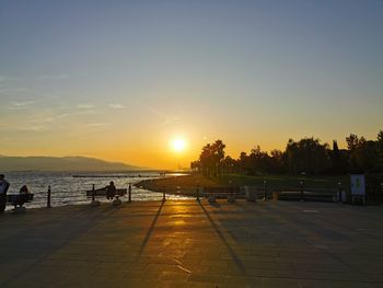 Scenic view of beach against sky during sunset