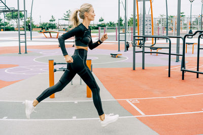 Woman athlete runner trains on the sports ground. person