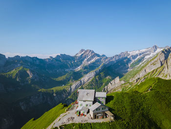 Scenic view of mountains against clear blue sky