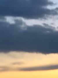 Low angle view of cloudy sky during sunset
