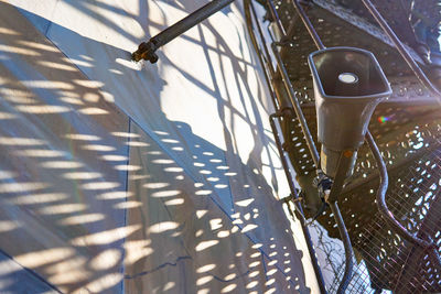 High angle view of bicycle by railing on wall