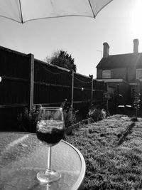 Glass of wine against clear sky