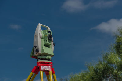 Low angle view of communications tower against sky