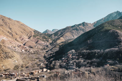 Aerial view of landscape and mountains against clear sky