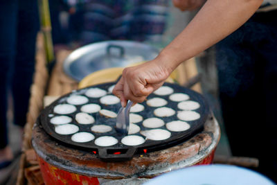 Close-up of hand making food