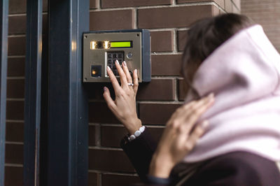 Rear view of woman using mobile phone