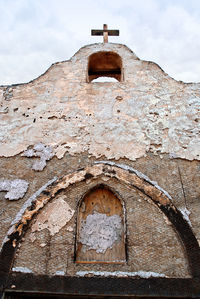 Low angle view of old building against sky