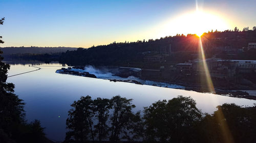 Scenic view of lake against sky during winter