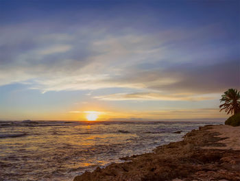 Scenic view of sea against sky during sunset