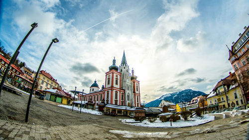 Panoramic view of buildings in city against sky