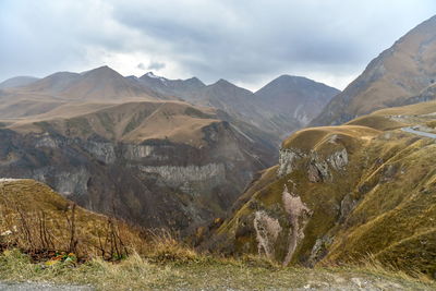 Scenic view of landscape and mountains against sky