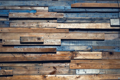 Old planks of various sizes and colors by random