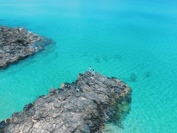 High angle view of rock formation in sea