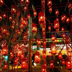 Low angle view of illuminated lights at night