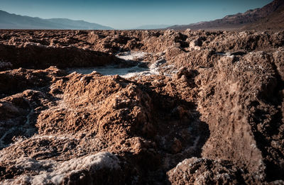 Scenic view of arid landscape against clear sky