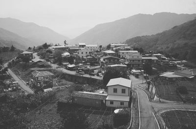 Houses on mountain range