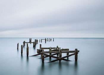 Scenic view of sea against cloudy sky