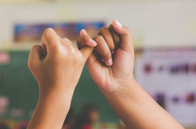 Close-up of hand holding hands