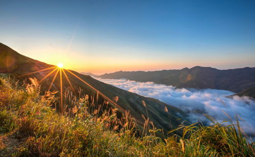 Scenic view of landscape against sky during sunset