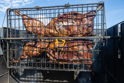 High angle view of meat on barbecue grill