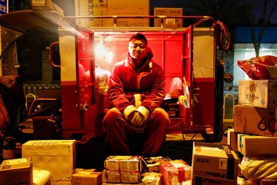 Full length of man sitting in traditional clothing