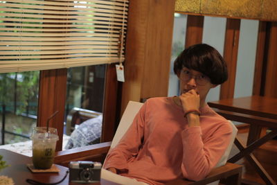 Portrait of man sitting in restaurant