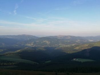 Aerial view of landscape with mountain range in background