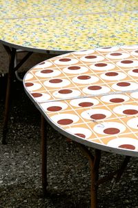 Close-up of chairs on table