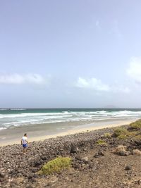 Scenic view of beach against sky