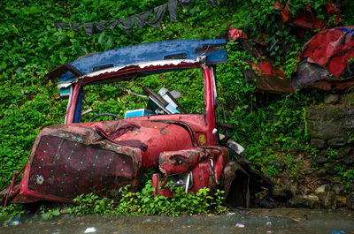 Abandoned car on field